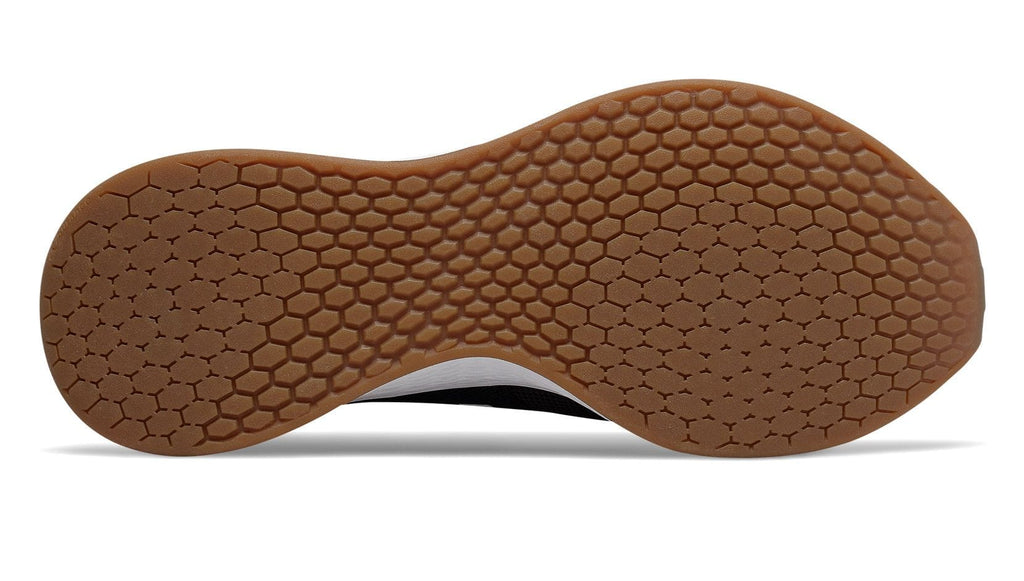 New Balance Fresh Foam Roav Tee Shirt running shoes outsole showcasing honeycomb traction pattern in brown rubber