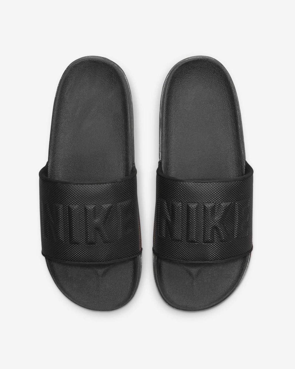 Nike Offcourt Slide sandals in black with textured strap featuring embossed Nike branding, top view.