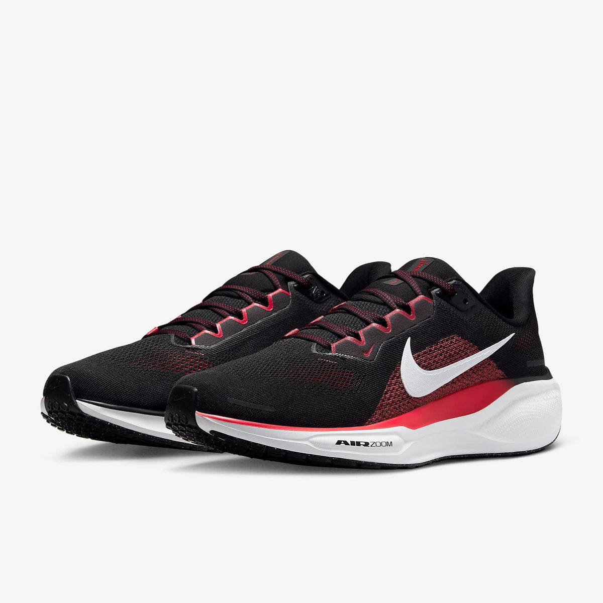 A pair of black Nike Air Zoom Pegasus 41 running shoes with white and red accents .