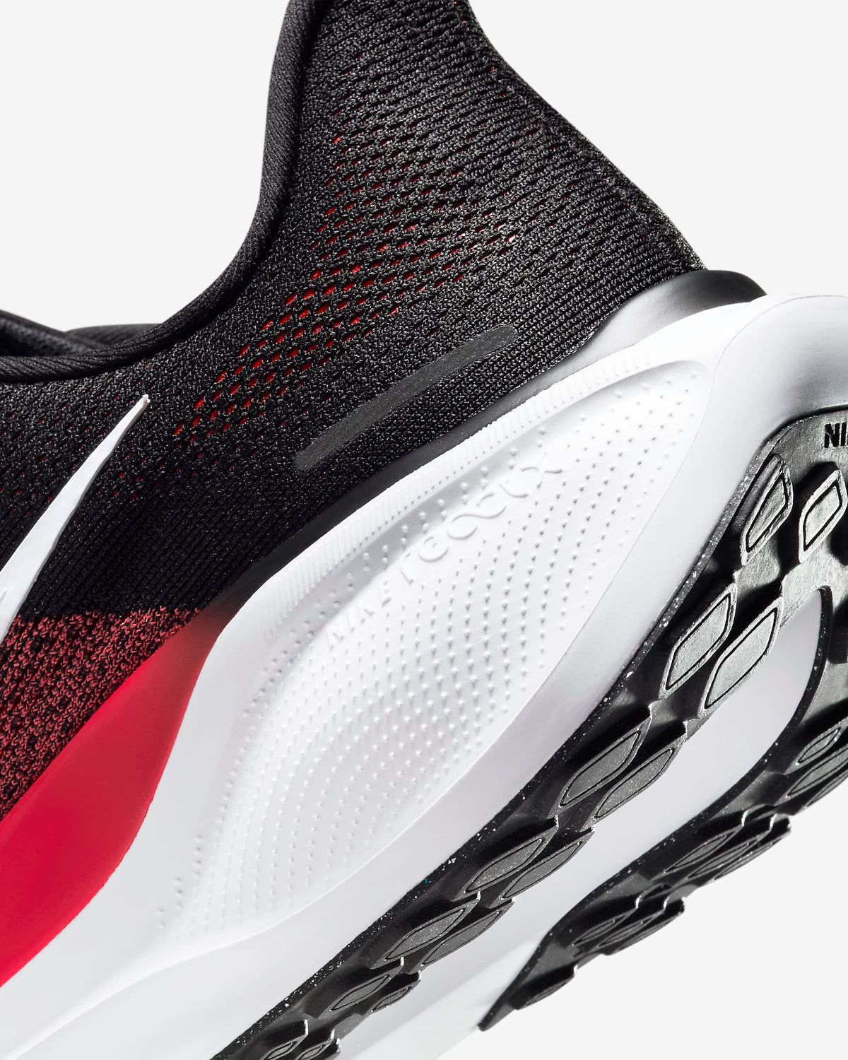 A pair of black Nike Air Zoom Pegasus 41 running shoes with white and red accents .