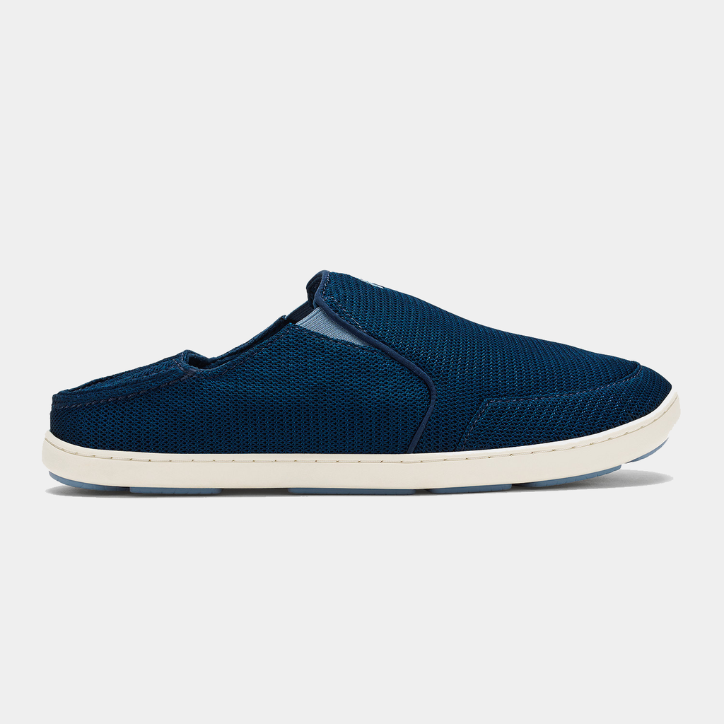 OluKai Nohea Mesh shoes in navy blue with a breathable mesh upper and a collapsible heel, side view.
